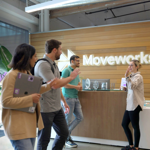 employees-greeting-each-other-in-lobby